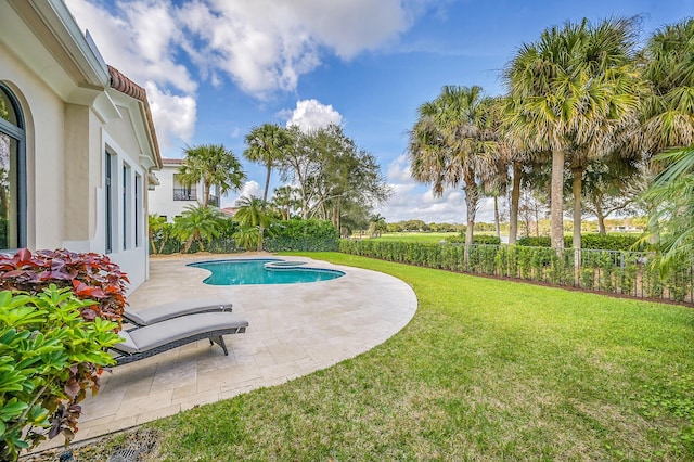 view of swimming pool with a yard and a patio area