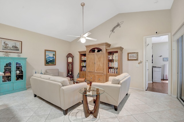 tiled living room featuring high vaulted ceiling and ceiling fan