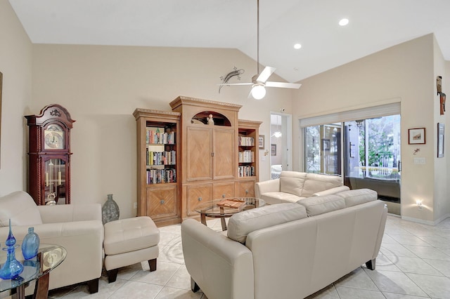 living room featuring vaulted ceiling, ceiling fan, and light tile patterned flooring