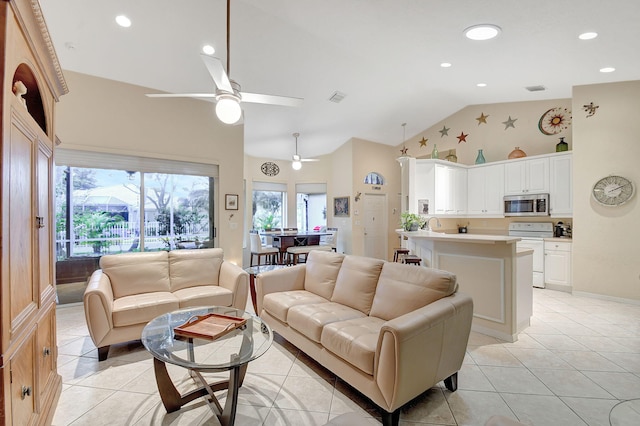 tiled living room featuring ceiling fan and high vaulted ceiling