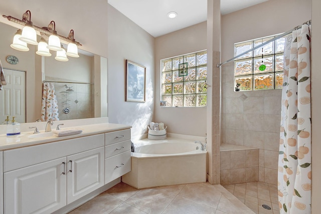 bathroom with vanity, shower with separate bathtub, and tile patterned flooring