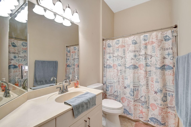 bathroom featuring vanity, toilet, and tile patterned flooring