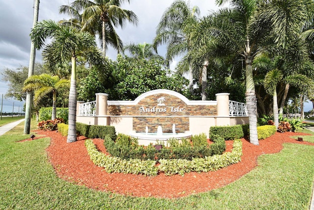 community / neighborhood sign with a lawn