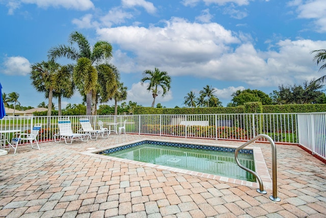 view of swimming pool with a community hot tub and a patio