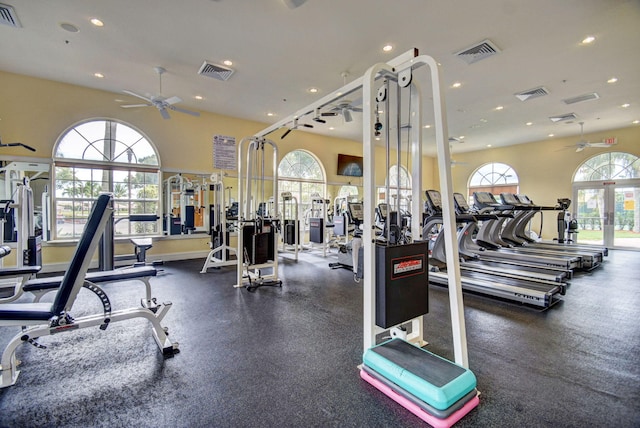 exercise room featuring ceiling fan and french doors