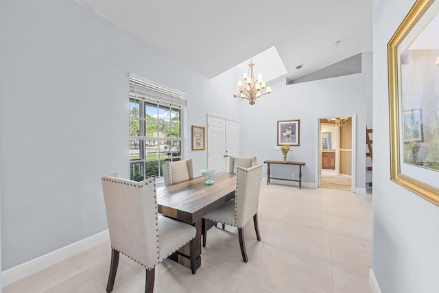 tiled dining room featuring high vaulted ceiling and a chandelier