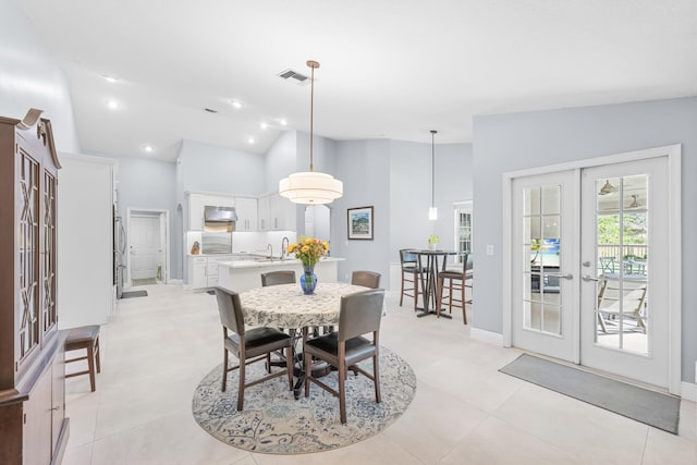 dining room with visible vents, recessed lighting, french doors, light tile patterned floors, and vaulted ceiling