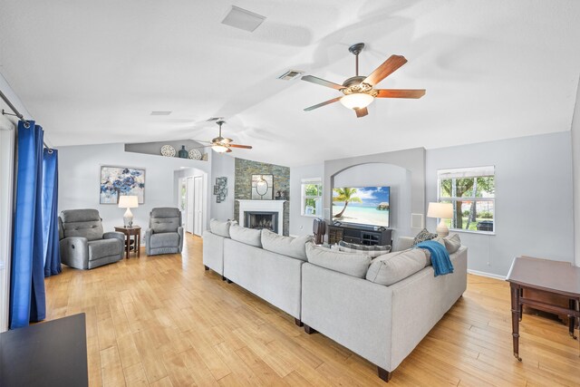 living room with lofted ceiling, light hardwood / wood-style flooring, french doors, and ceiling fan