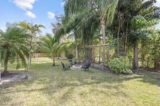 view of yard with an outdoor fire pit