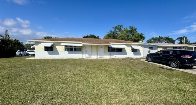 ranch-style home with a front yard