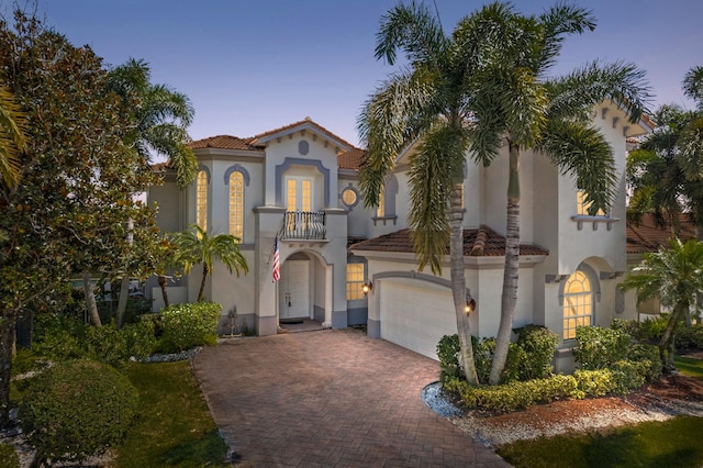 mediterranean / spanish-style home featuring a balcony