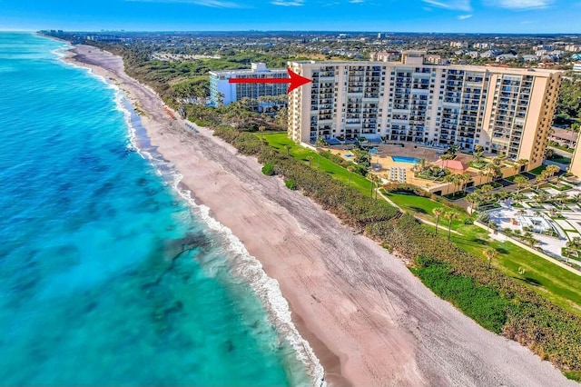 bird's eye view with a beach view and a water view