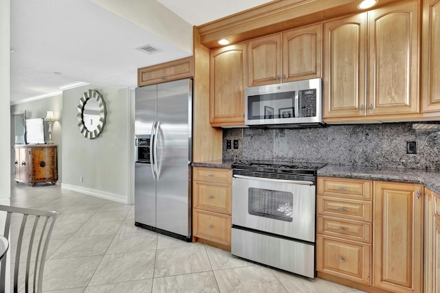 kitchen with stainless steel appliances, crown molding, decorative backsplash, and dark stone counters