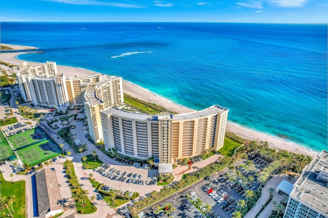 aerial view featuring a water view and a beach view