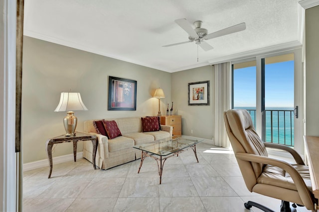 living room featuring ornamental molding, a water view, and ceiling fan