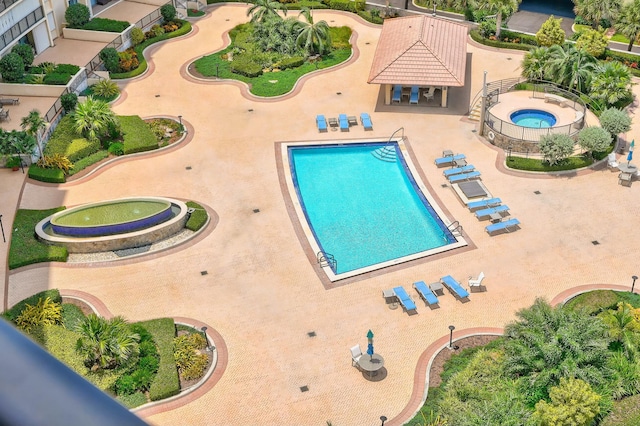 view of pool featuring a patio area and a community hot tub