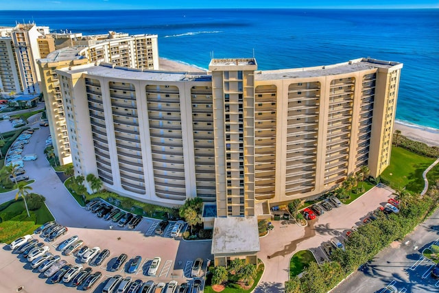 aerial view featuring a view of the beach and a water view