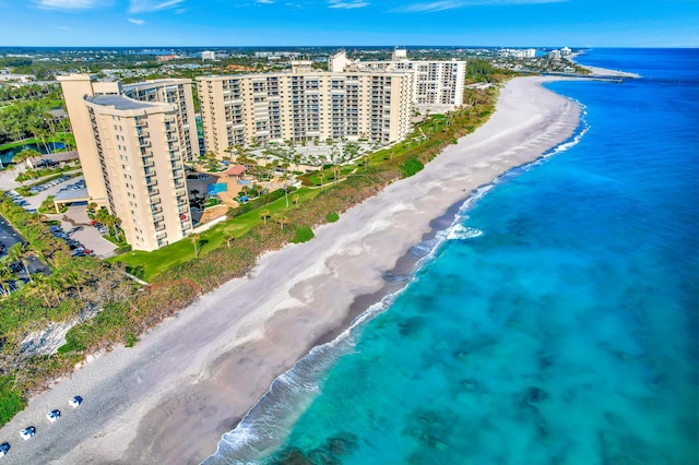 birds eye view of property featuring a view of the beach and a water view