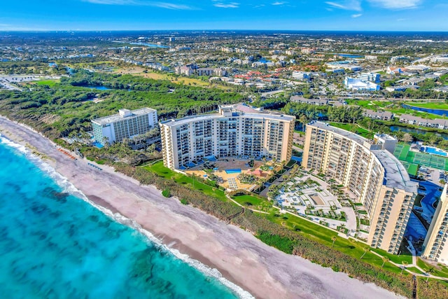 birds eye view of property with a view of the beach and a water view