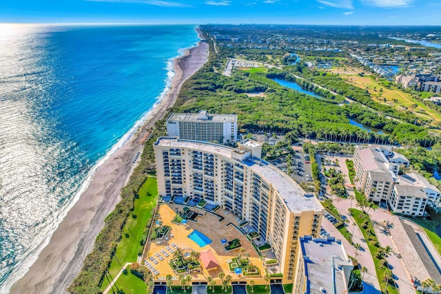 bird's eye view featuring a view of the beach and a water view