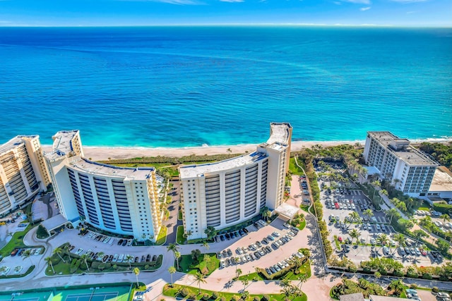 birds eye view of property featuring a view of the beach and a water view