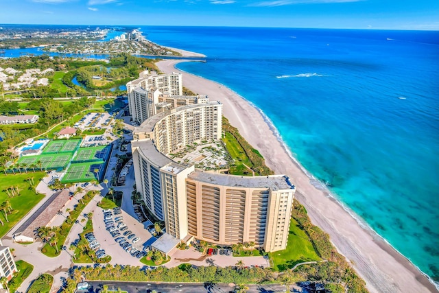 aerial view with a water view and a view of the beach