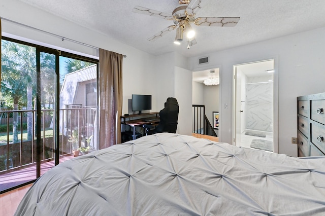 bedroom featuring connected bathroom and a textured ceiling