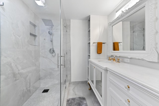 bathroom featuring vanity and an enclosed shower