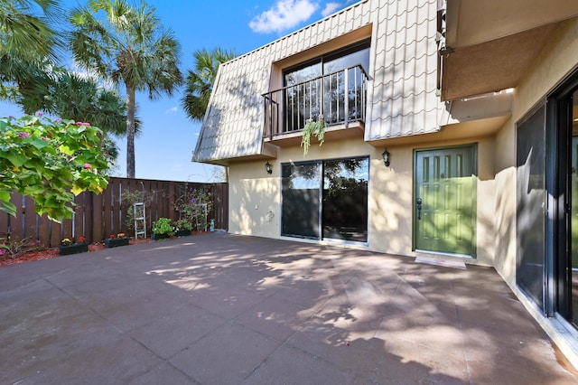 rear view of property featuring a patio