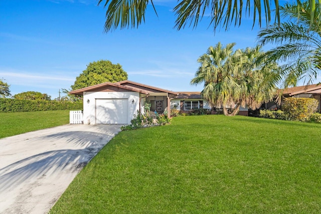 ranch-style home featuring a garage and a front yard