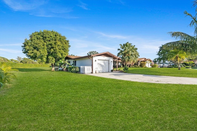 ranch-style house with a garage and a front yard