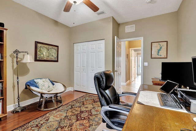 office area with ceiling fan and light hardwood / wood-style flooring