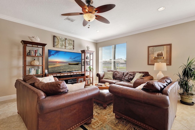 tiled living room featuring a textured ceiling, ornamental molding, and ceiling fan