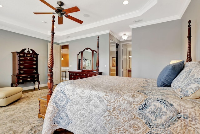 bedroom with visible vents, a raised ceiling, baseboards, ceiling fan, and ornamental molding