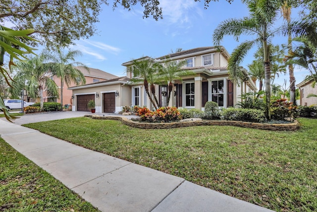 view of front facade with a garage and a front lawn