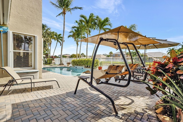 view of patio / terrace with a fenced in pool