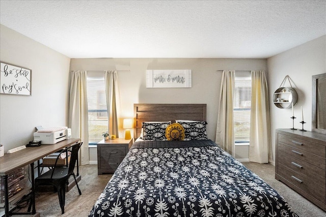 carpeted bedroom with a textured ceiling