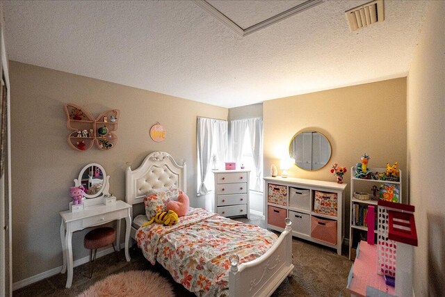 bedroom featuring dark carpet and a textured ceiling