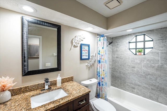 full bathroom featuring shower / bathtub combination with curtain, vanity, and toilet