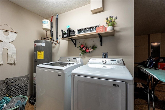 laundry room with washer and clothes dryer, water heater, and a textured ceiling