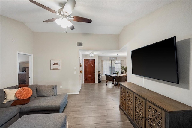 living room with vaulted ceiling and ceiling fan