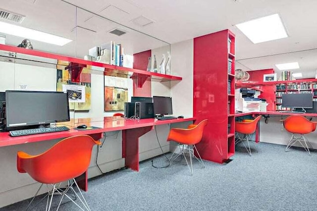 office area with visible vents and built in desk