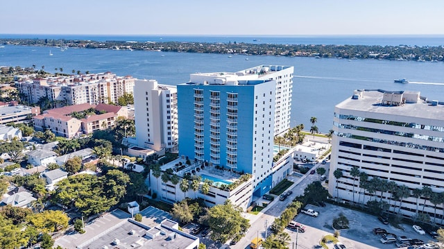 birds eye view of property featuring a water view and a view of city