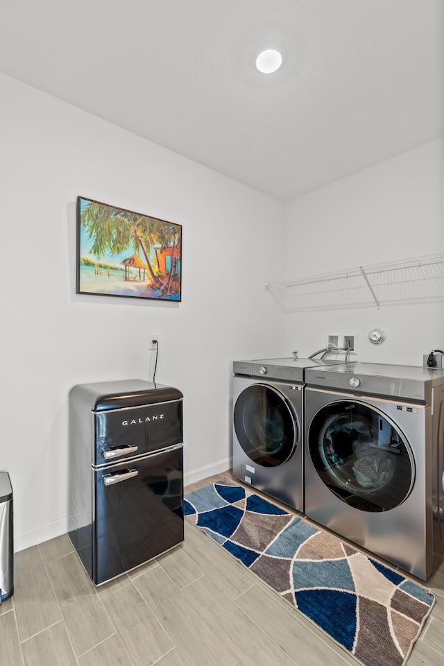 laundry area with washing machine and dryer