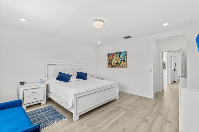 bedroom with light hardwood / wood-style floors