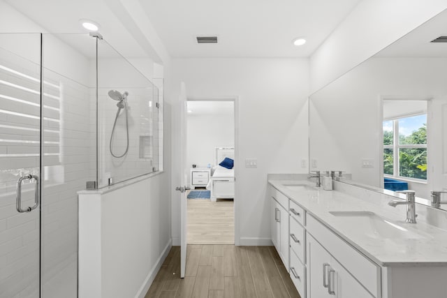 bathroom with vanity and walk in shower