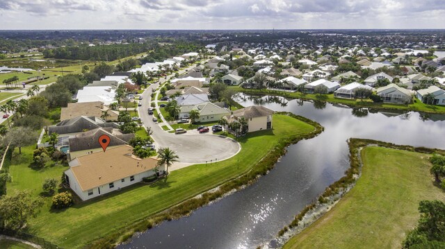 aerial view featuring a residential view and a water view