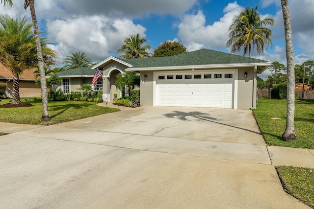 ranch-style home featuring a garage and a front yard