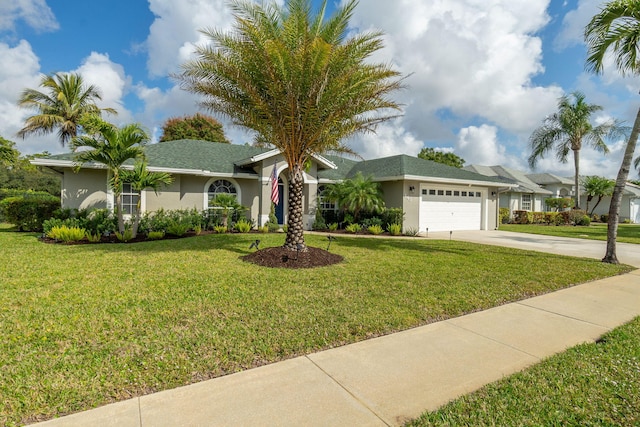 ranch-style house with a garage and a front yard