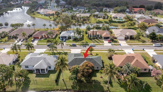 birds eye view of property with a water view